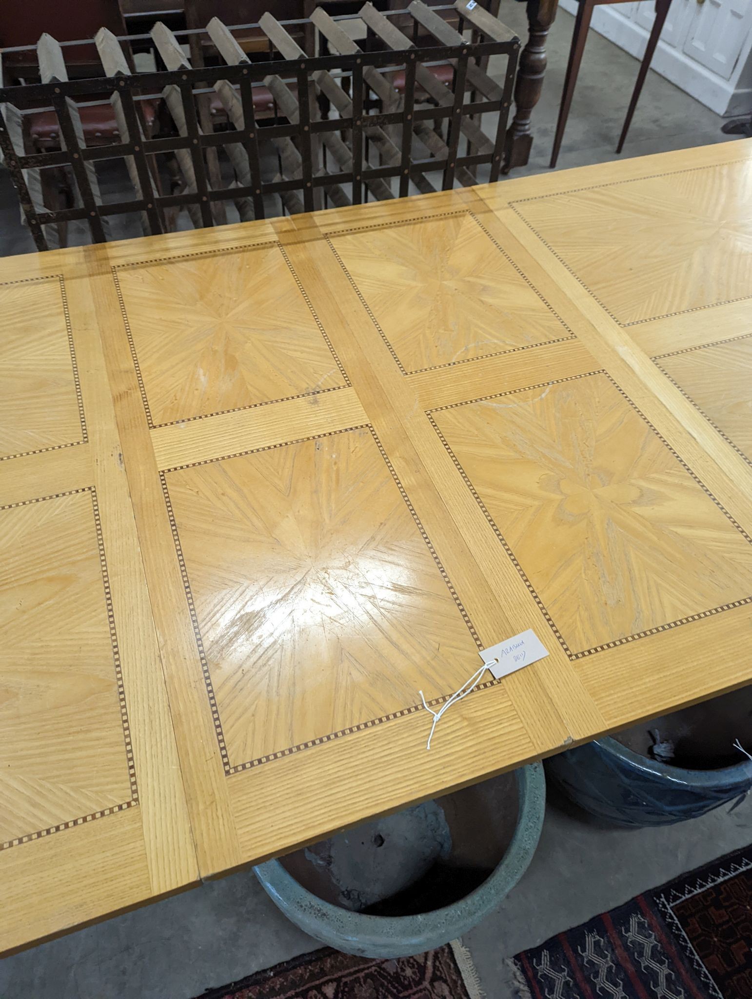 A contemporary inlaid oak extending dining table, 237cm extended, width 107cm, height 75cm